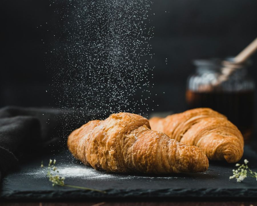 Croissants dusted with flour (stock photo)